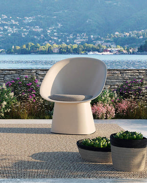 Sensu chair by TOOU: Eco-friendly, fan-shaped for indoor/outdoor use, merging comfort with Japanese-inspired elegance.