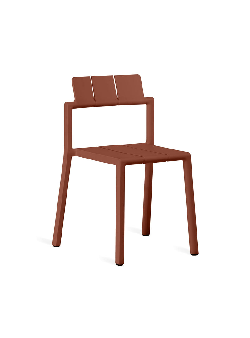 YARD Chair in rust red by TOOU Design, a lightweight and stackable seating solution for modern indoor and outdoor use.